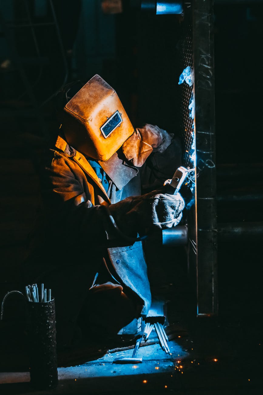 person welding metal